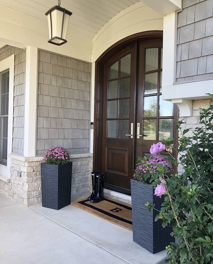 My Arched Real Wood Double Doors Pros And Cons Caroline On Design Arched Real Wood Double Doors Mahogany On Front Porch With Purple Mums