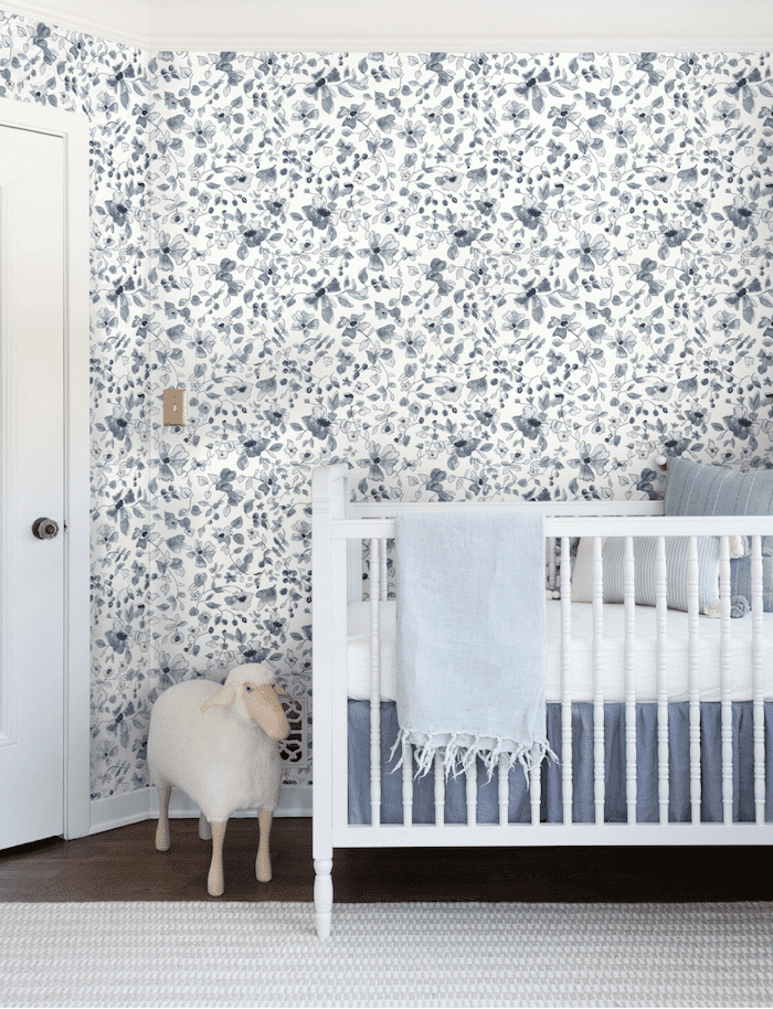 blue floral wallpaper in baby nursery