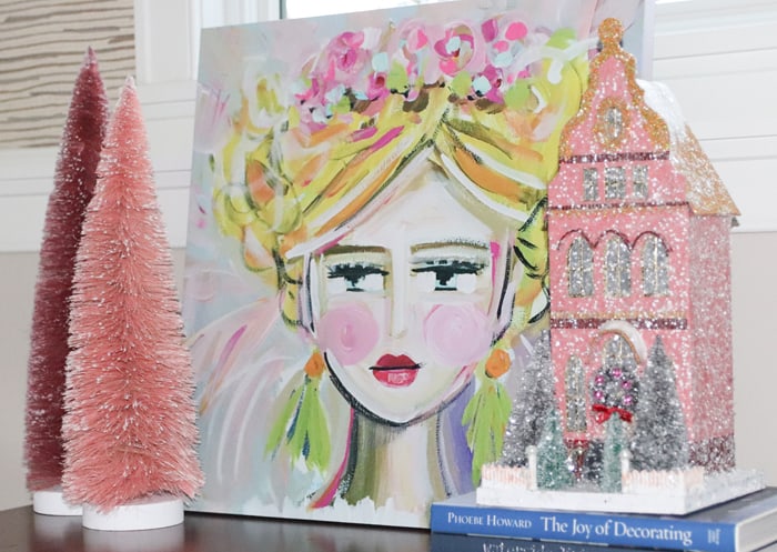 Pink glittery Cody Foster Christmas village house with pink bottlebrush trees and Maren Devine feminine art.