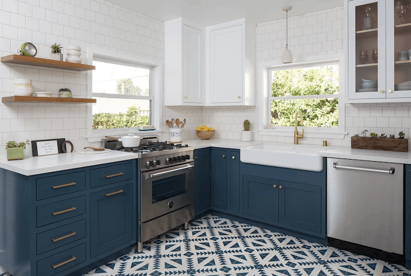 Moody Blue lower cabinets with white upper cabinets and geometric tile floor