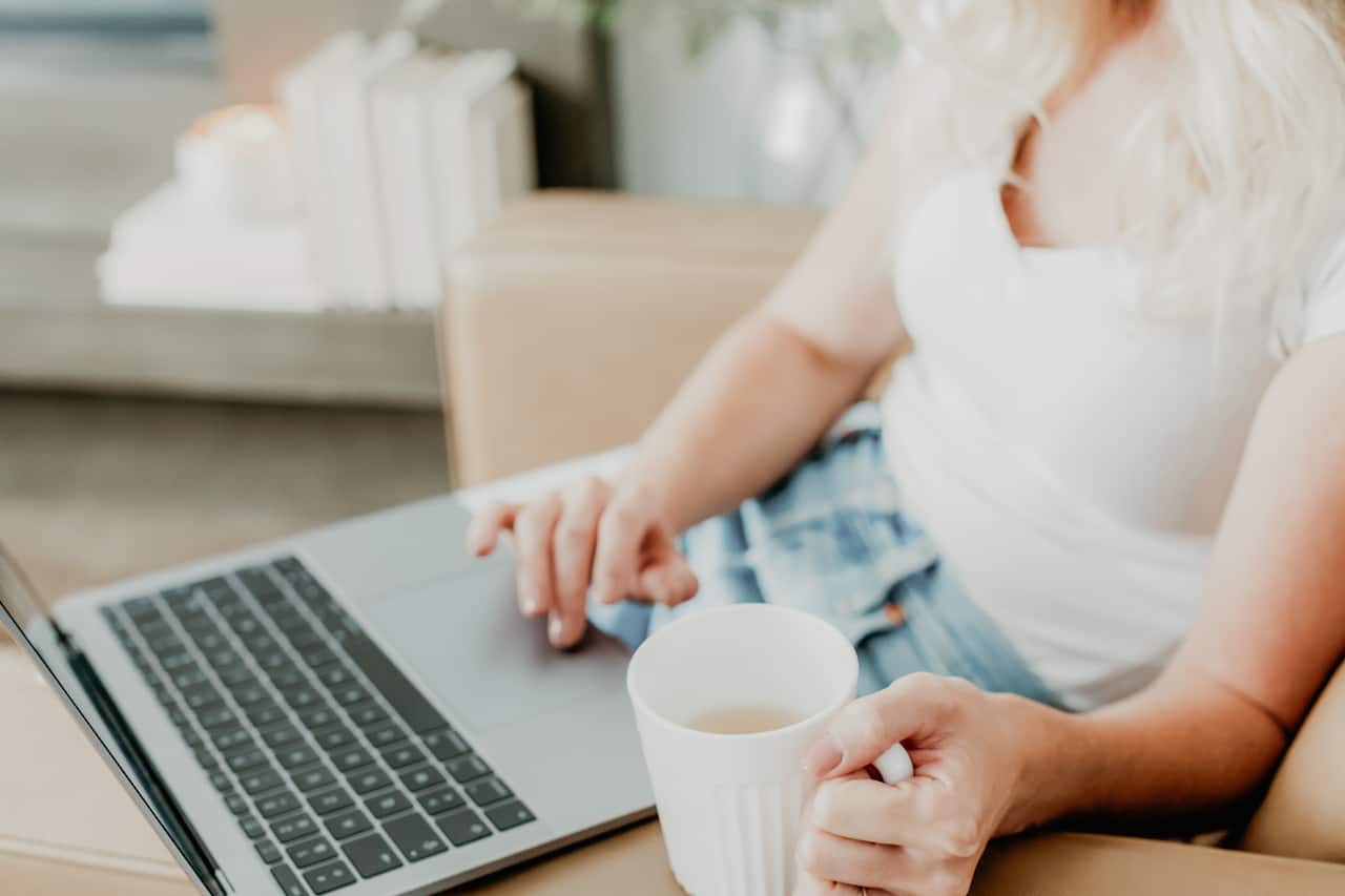 Stock image with woman hands on computer