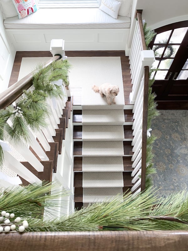 Dramatic stair case decorated with Christmas garland