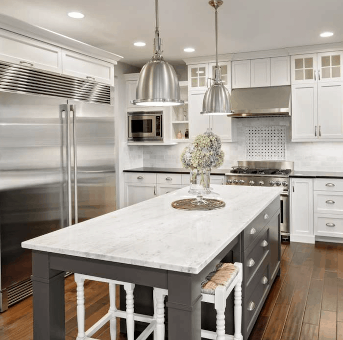 grey and white kitchen with porcelain countertops and shaker style cabinet doors